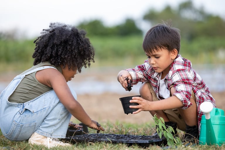 Children planting in soil