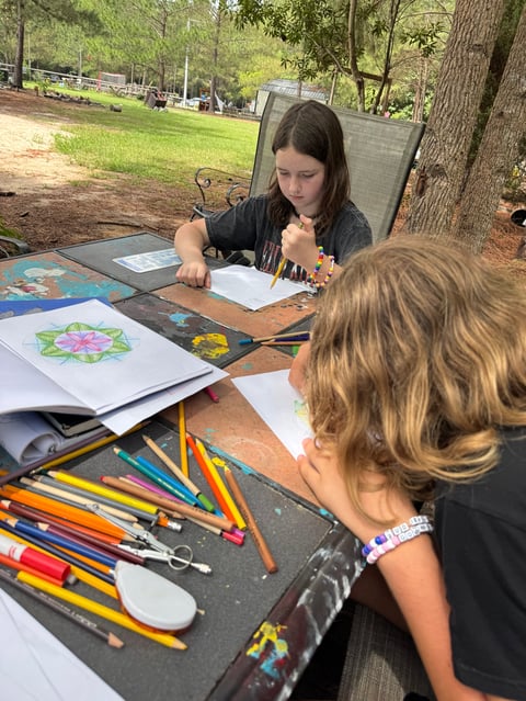 Student working on geometric form drawing, creating a twelve-pointed circle during a middle school geometry lesson.